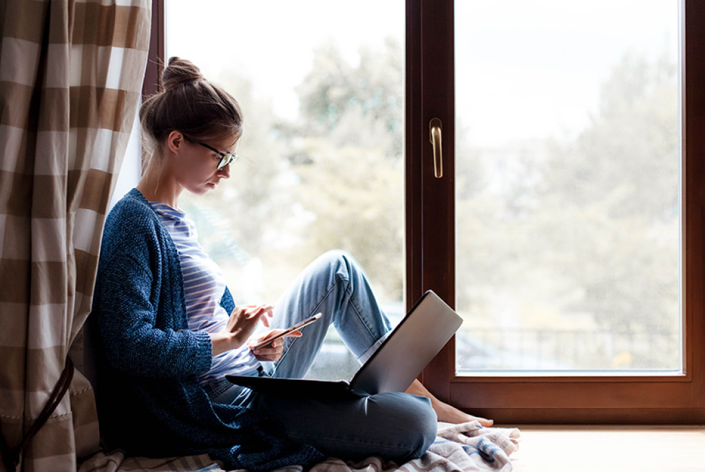 Woman working next to window